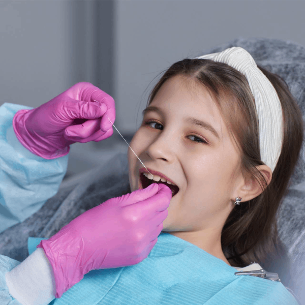 Little girl getting dental treatment