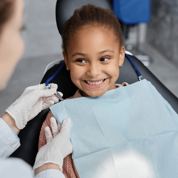 Little girl getting dental treatment