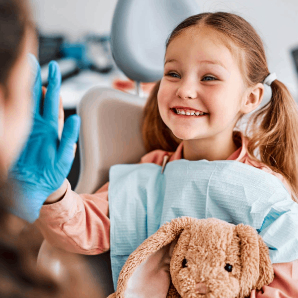 Dentist high-fiving child