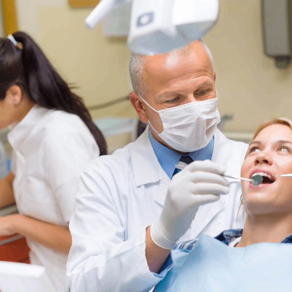 Dentist treating patient