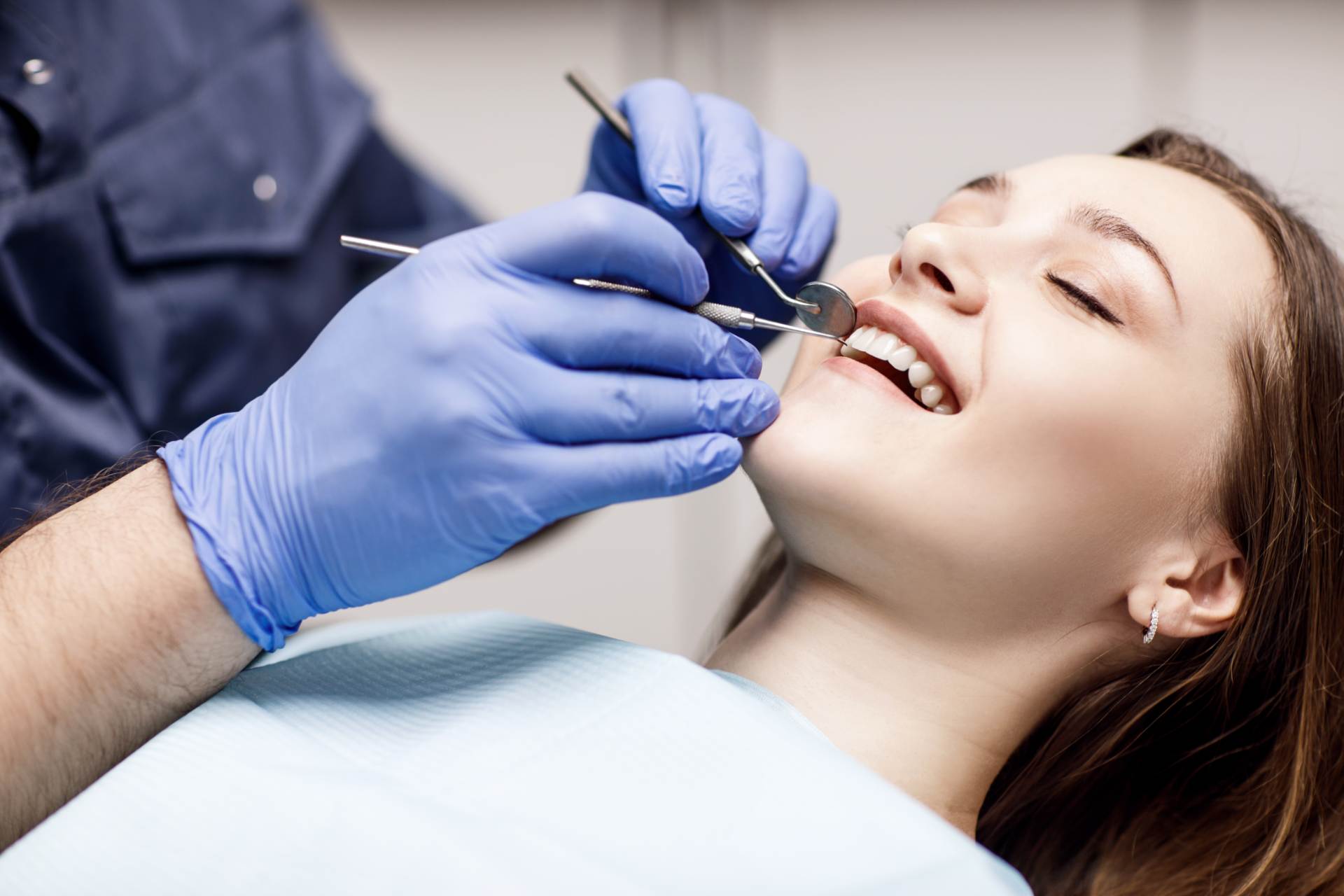 Dentist treating patient